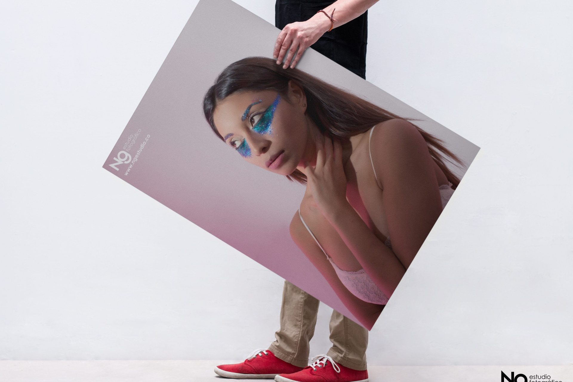 Free PSD of a Man Holding a Poster Mockup (3)